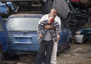 Gonzo carrying away No-Doze's dead body.