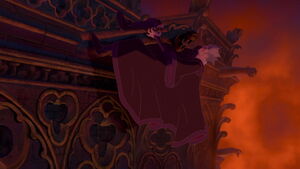 Frollo thrown off balance and he clings onto the gargoyle's head.