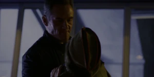 Grigori having grabbed Joyce before she can get a hold of the gun.