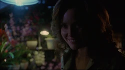 Gloria attacks Clark in a greenhouse.