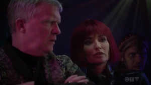 Izel threatening Mister Kitson's life.