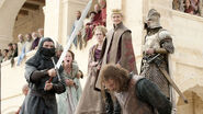 Ilyn Payne (left, holding Ned's sword) during the execution of Ned Stark