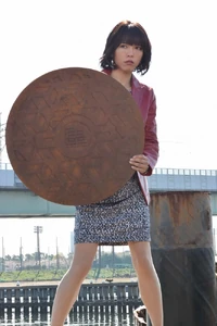 Yuko with her trademark manhole cover.