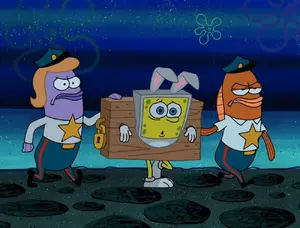 Two officers arresting SpongeBob for not inviting them to his party.