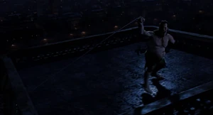 Mr. Hyde pulling on the rope but stumbles back and falls off the rear of the tower.