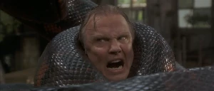 Serone being crushed by the anaconda after it catches him.