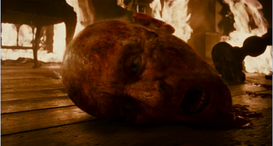 Sir John's severed head after he is decapitated by Lawrence.