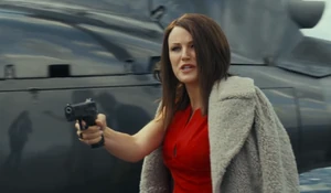 Claire smirking as she holds Kate at gunpoint.