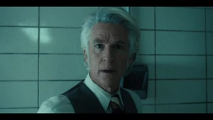 Having been told by Ten that Six and Dr. Ellis have just been murdered, Brenner hears people screaming outside in the hallway.