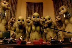 Jocrassa and the other Slitheen waiting on the phone call for codes