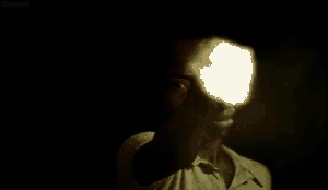 Dadinho laughing after killing a couple that was just robbed by his friends.