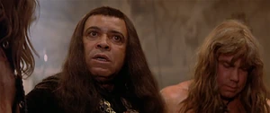 Doom and his men plotting to assault Conan and his followers during their escape.