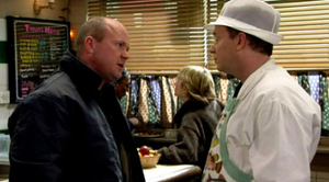 Phil taunts Ian over his bankruptcy and outbidding him for the cafe ownership (2001).