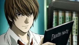 Light holding the iconic Death Note.