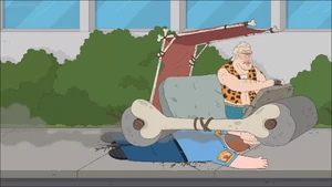 Ron Perlman runing over and crushing Dusty Marlow in his caveman car.