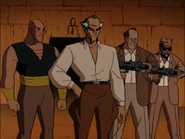 Ubu and the others holding Batman and Talia at gunpoint