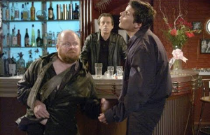 Phil Mitchell punching Dennis Rickman in his final confrontation against Dirty Den on Christmas Day 2003.