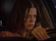 A drunk Rachel behind the wheel, mere moments before the crash she created.