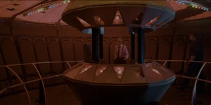 Grigori talking to Kline inside the fair's Gravitron ride.