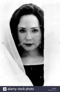 Adriana coming out from the curtains of Nicholas' shrine.