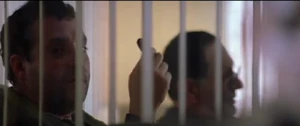 Paulie glaring threateningly at Dean.