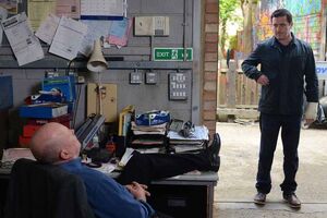Phil Mitchell having a friction with local extortionist Carl White.