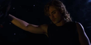 Billy looking at an unconscious Heather who he managed to capture.