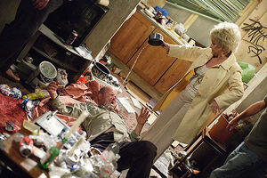 Phil gets woken up by Peggy as she confronts him over his drug addiction (2010).
