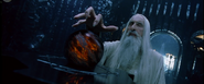 Saruman conversing with Sauron, using the palantír of Orthanc