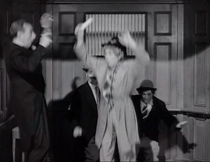 Grover barely getting the picture just as the elevator hits ground floor