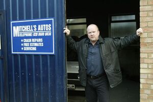 Phil Mitchell as the owner of the mechanic shop.