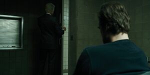 Brenner entering Jim Hopper's cell.