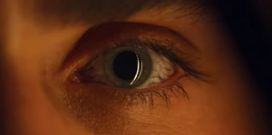 Billy's eye getting covered in black veins.