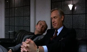 Dick Jones making a deal with Clarence Boddicker by offering him weapons capable of destroying RoboCop.