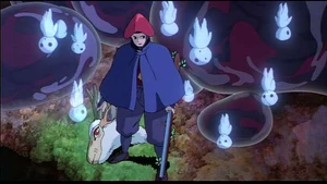 Lady Eboshi holding the Forest Spirit's head.