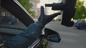 Karen's gun is shot out of her hands by Cooper