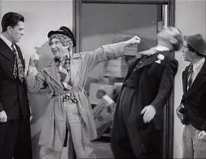 Grover punched by Wacky