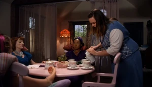 Samantha having a tea party with her "dolls."