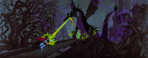 Maleficent blasting fire at Phillip who protects himself with his shield.