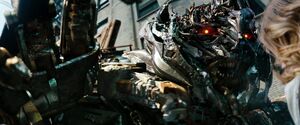 Megatron almost lashes out at Carly before realizing she's right about Sentinel.