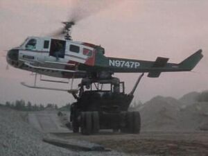 The truck misses the helicopter as it pulls up.