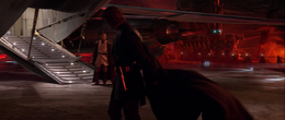 Vader removes his Jedi robes readying to fight.