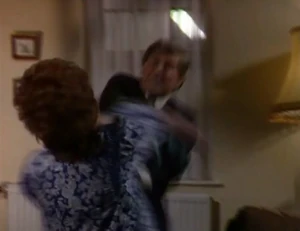 Alan smacking Rita when she attempts to escape him.