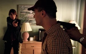 Neil is arrested at his hotel room with the tortured hooker.