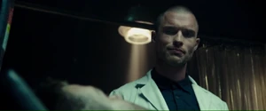 Ajax talking with Wade in the laboratory.
