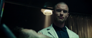 Ajax talking with Wade in the laboratory