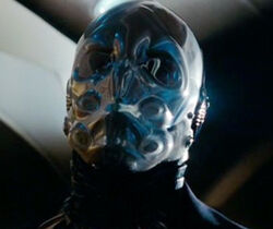 Rexford Lewis wears the plastic mask of Commander