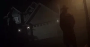 The Mad Artist stalks Corey at night outside his home.