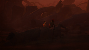 The two walk among the ruins near a collapsed Nightsister statue.