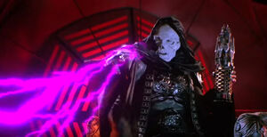 Skeletor kills Saurod with his lightning powers.